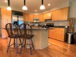 Fully equipped kitchen with breakfast bar seating 
